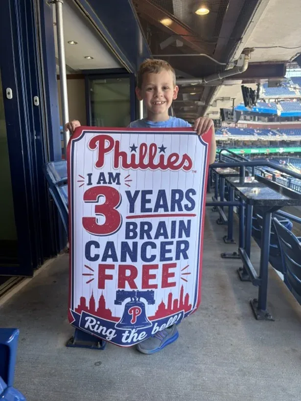 A Kisses for Kyle family celebrating three years cancer free at a Phillies game